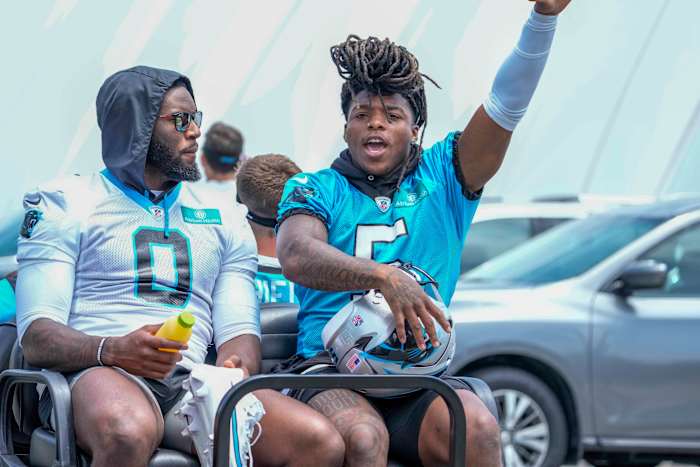 Carolina Panthers linebacker Brian Burns (0) and wide receiver Laviska Shenault Jr. (5) on the way to practice during the Carolina Panthers minicamp.
